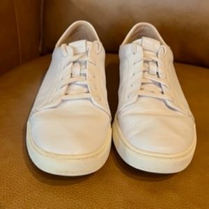 OluKai Pehuea Lī ‘Ili Women's white leather lace-up sneaker.